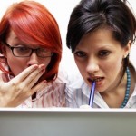 Two businesswomen are very surprised Two businesswomen are very surprised
