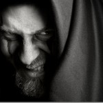 Evil sinister man with malefic wicked grin Evil sinister man with malefic wicked grin