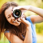 young smiling girl making photo