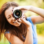 young smiling girl making photo young smiling girl making photo
