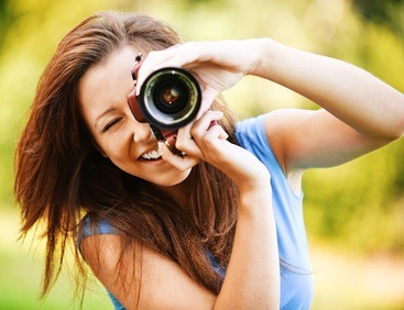 young smiling girl making photo