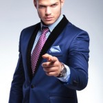 young business man pointing at you young business man pointing at you
