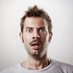 Portrait of a surprised young man