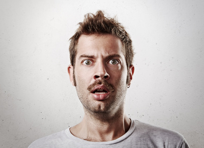 Portrait of a surprised young man